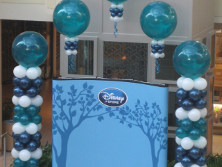 Disney Store grand opening balloon arch in retail mall