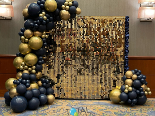 Gold shimmer call with organic balloon garland for corporate award dinner navy and gold Westin hotel