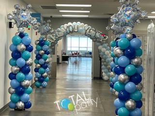Winter wonderland snowflake balloon columns and arch Amazon warehouse employee area Are You Yeti