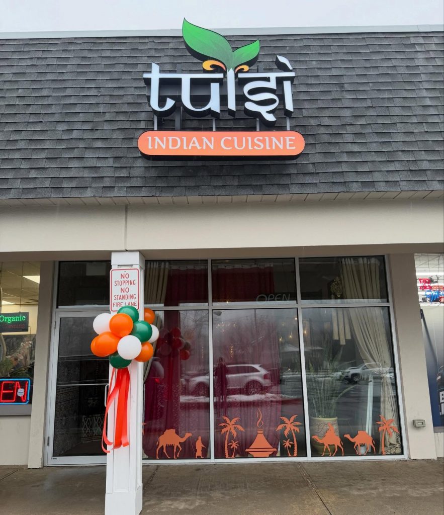 Ribbon cutting ceremony today at @tulsi.indiancuisine!  Welcome! @ebregionalchamberofcommerce @balloonsbytotalparty